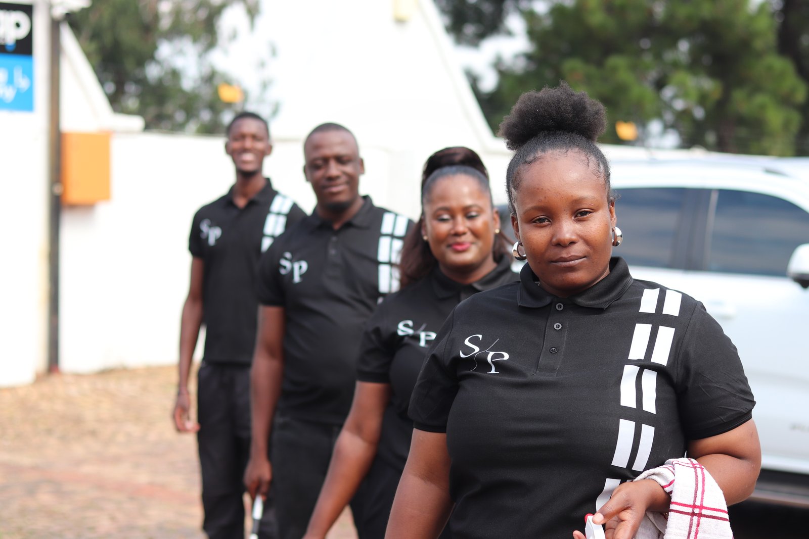 SparklePro team members in their branded uniforms